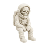 Figura 3D Astronauta Esqueleto Fósil Sentado 10.6 cm