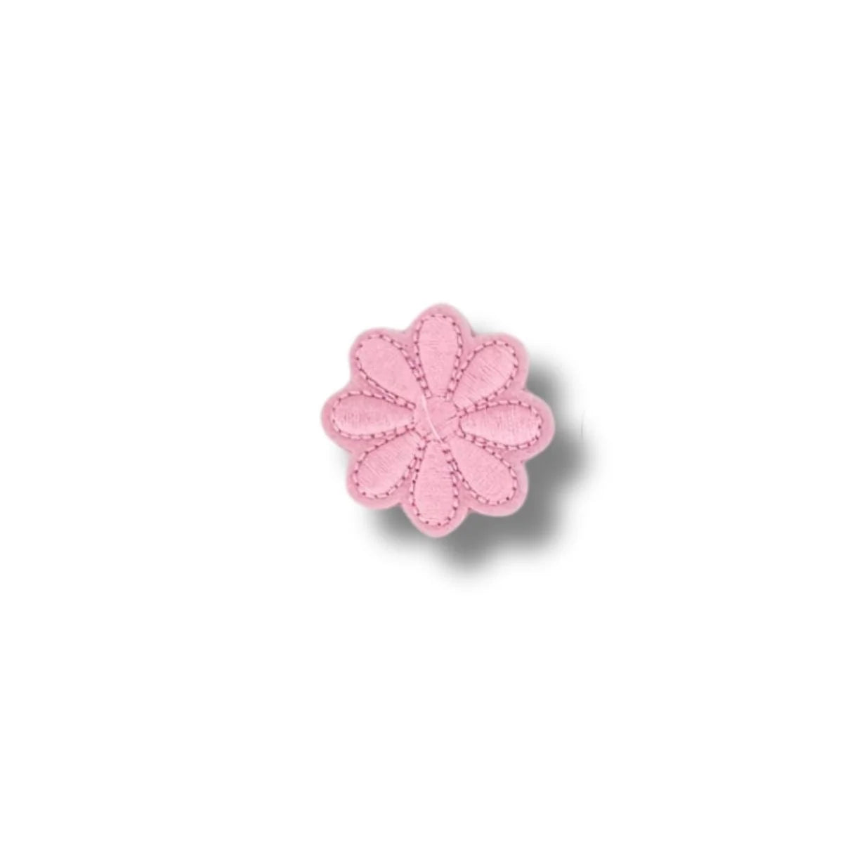 Flor rosada pastel de ocho pétalos con contorno fino.