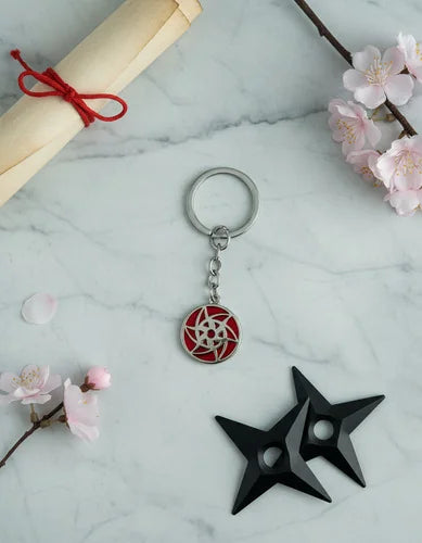 Llavero Metálico Mangekyo Sharingan de Sasuke Uchiha
